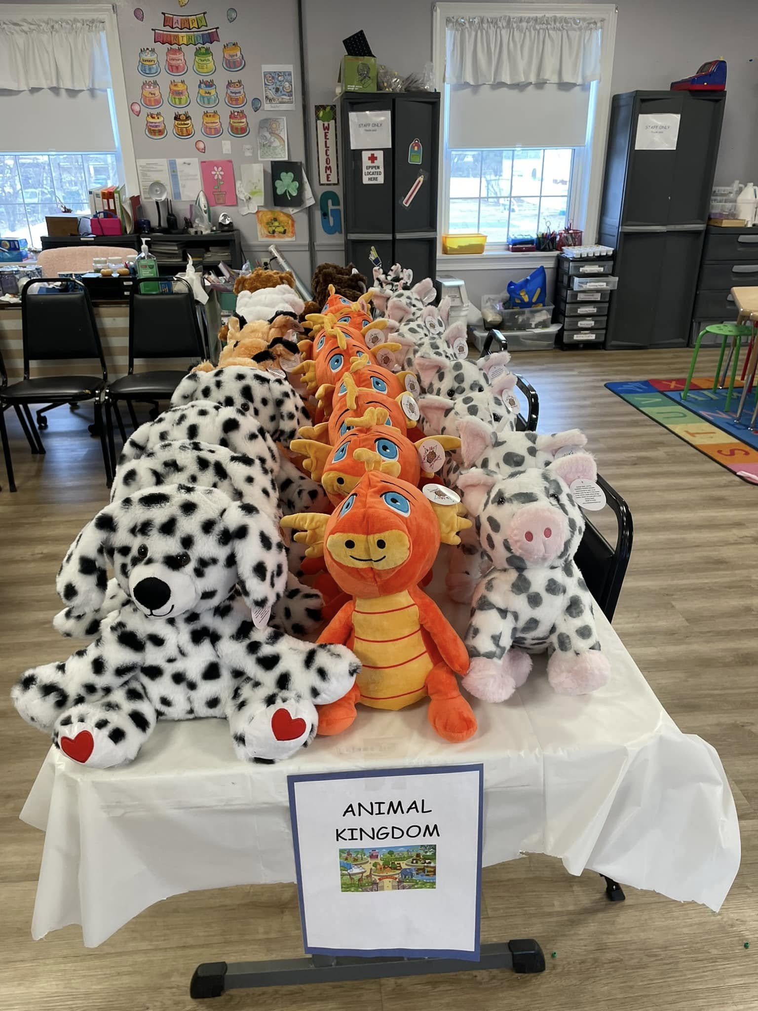 A child at a library workshop with their finished Furry Friend in hand