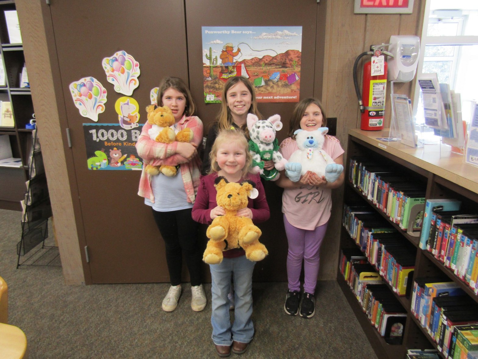 Library workshop with kids holding their unstuffed Furry Friends