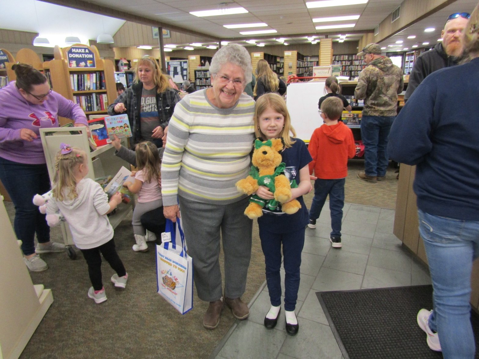 Children with their finished Furry Friends at a library workshop event