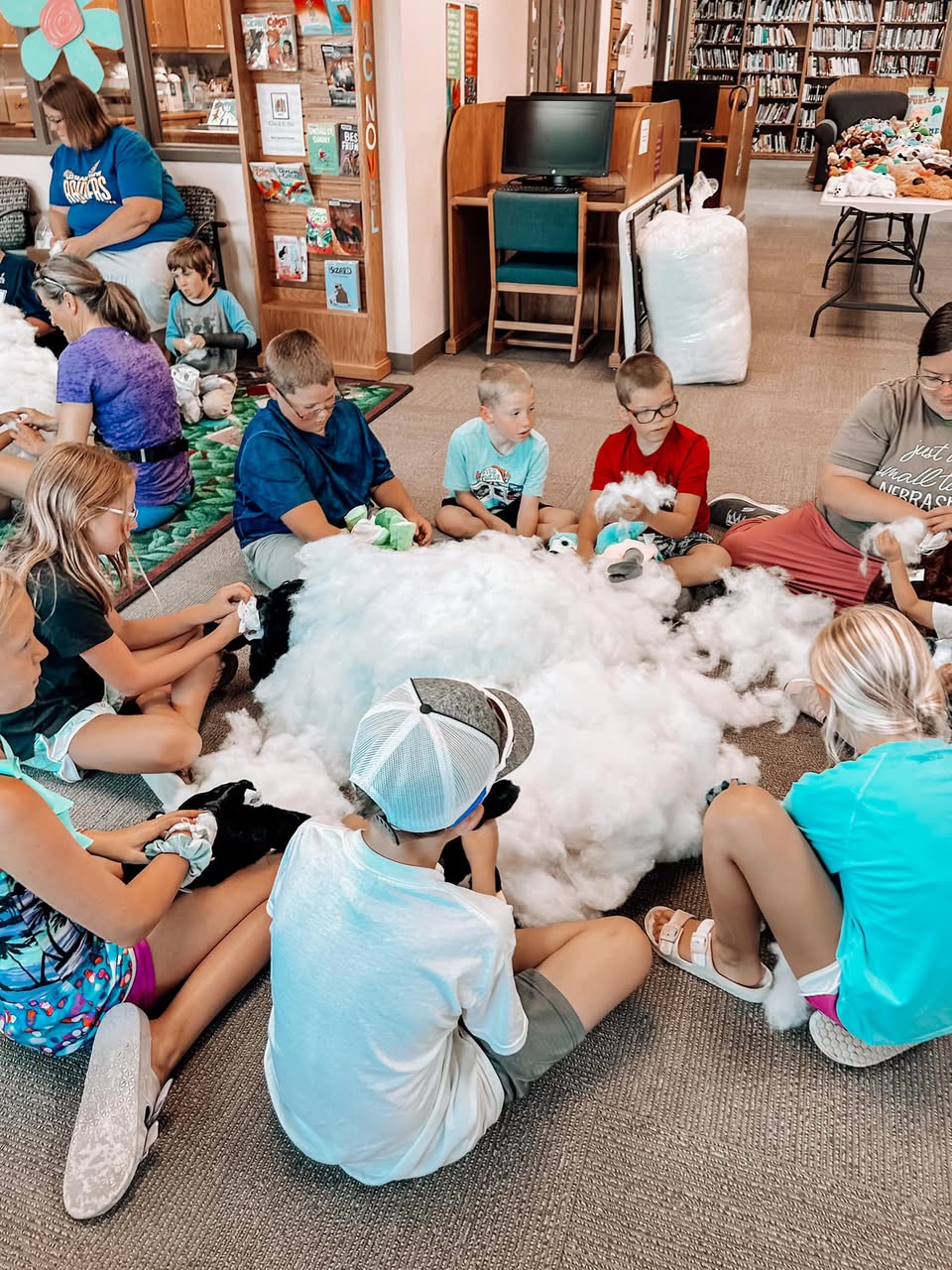 A child meeting a Furry Friend at a library workshop