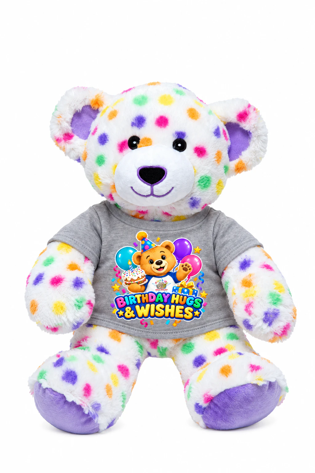 A white plush teddy bear with colorful spots wearing a gray Birthday Hugs & Wishes shirt