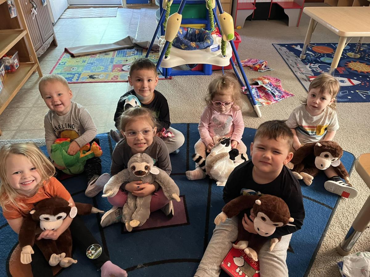 Children smiling with their handmade Furry Friends